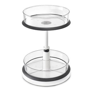 A two-tiered round acrylic plastic lazy Susan organizer