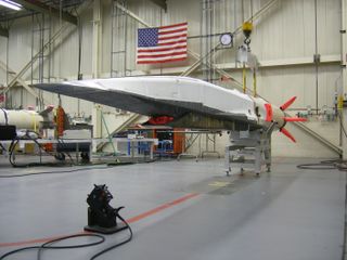 An X-51 Waverider hypersonic test vehicle is seen in an Air Force hangar prior to a record-setting May 2010 test flight that marked the longest hypersonic flight.