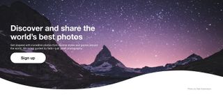Homepage of 500px, one of the best Google Photos Alternatives, showing mountains under a starry night sky