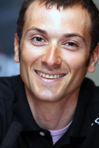 Ivan Basso smiles as his manager names him in the Tour de Fance team
