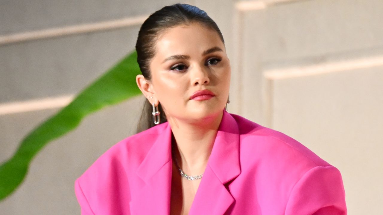 Selena Gomez wears a bright pink suit jacket in 2023