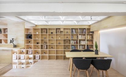 Restaurant dine area with table and book shelf