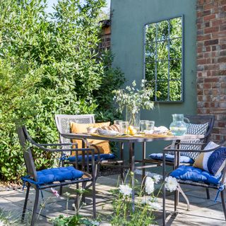 garden with brick wall and table chair