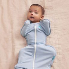 Baby wearing Love to Dream blue Swaddle Up