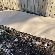 ram board covering weeds in garden