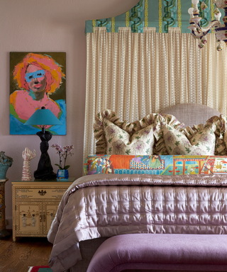 Pale purple maximalist bedroom with large headboard