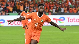vory Coast's forward #11 Jean Philippe Nils Stephan Krasso, wearing orange national team colours, runs the pitch ahead of the Ivory Coast vs Nigeria live stream