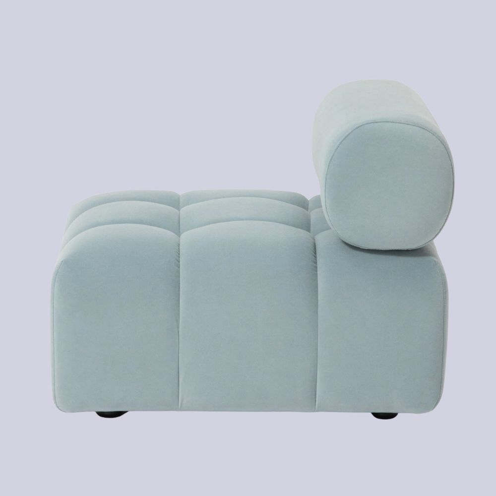 FrancFranc Puffy Sofa Armless Blue against pale lilac background.