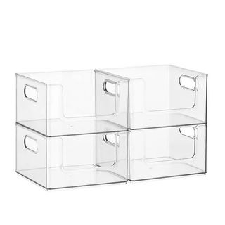 Four clear containers with cut out handles and a large open front stacked in pairs