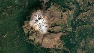 aerial view of Mount Adams in Washington state with ice covered peak and green vegetation surrounding