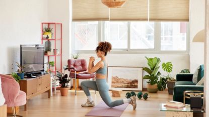 Woman holding a lunge at home