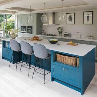 kitchen with white interior and white dining table and grey chairs and blue shelf
