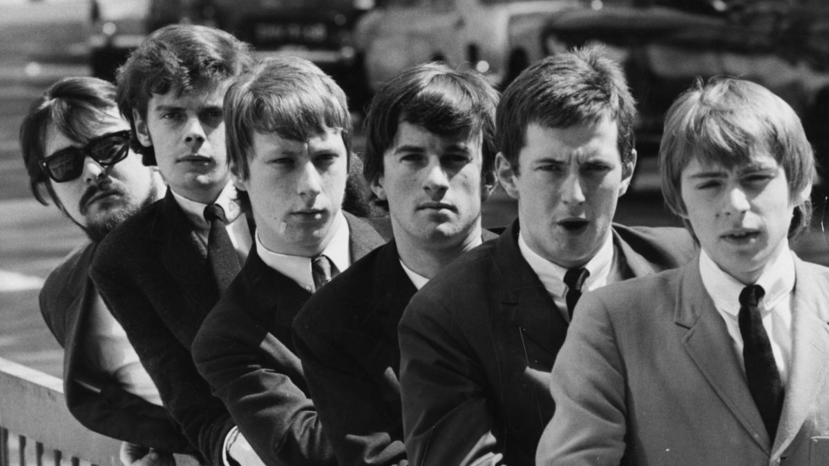 English band 'The Yardbirds' leaning on a railing; (L-R) Manager Giorgio Gomelsky, Paul Samwell-Smith, Chris Dreja, Jim McCarty, Eric Clapton and Keith Relf, circa 1965