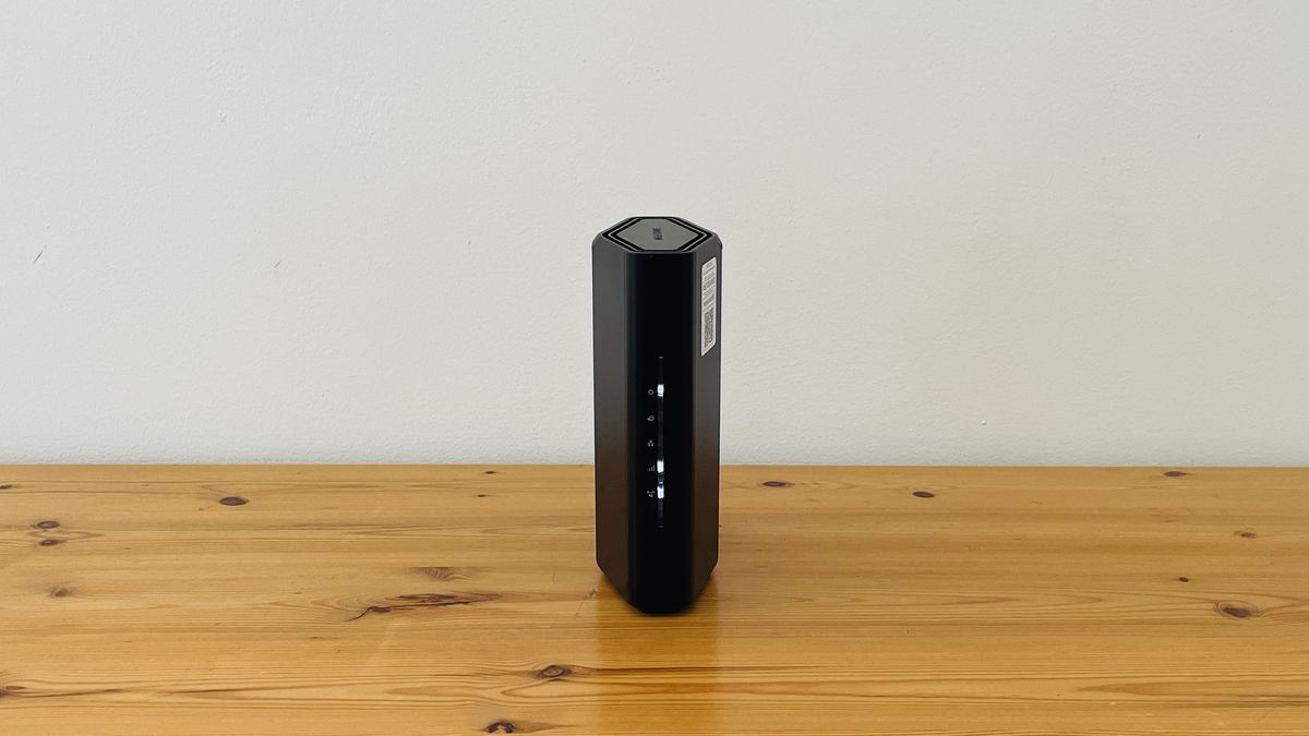 Netgear Nighthawk RS100 router on wooden table