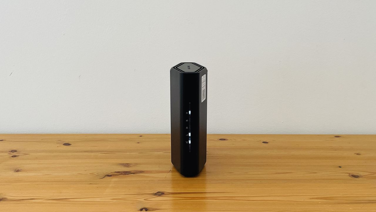 Netgear Nighthawk RS100 router on wooden table