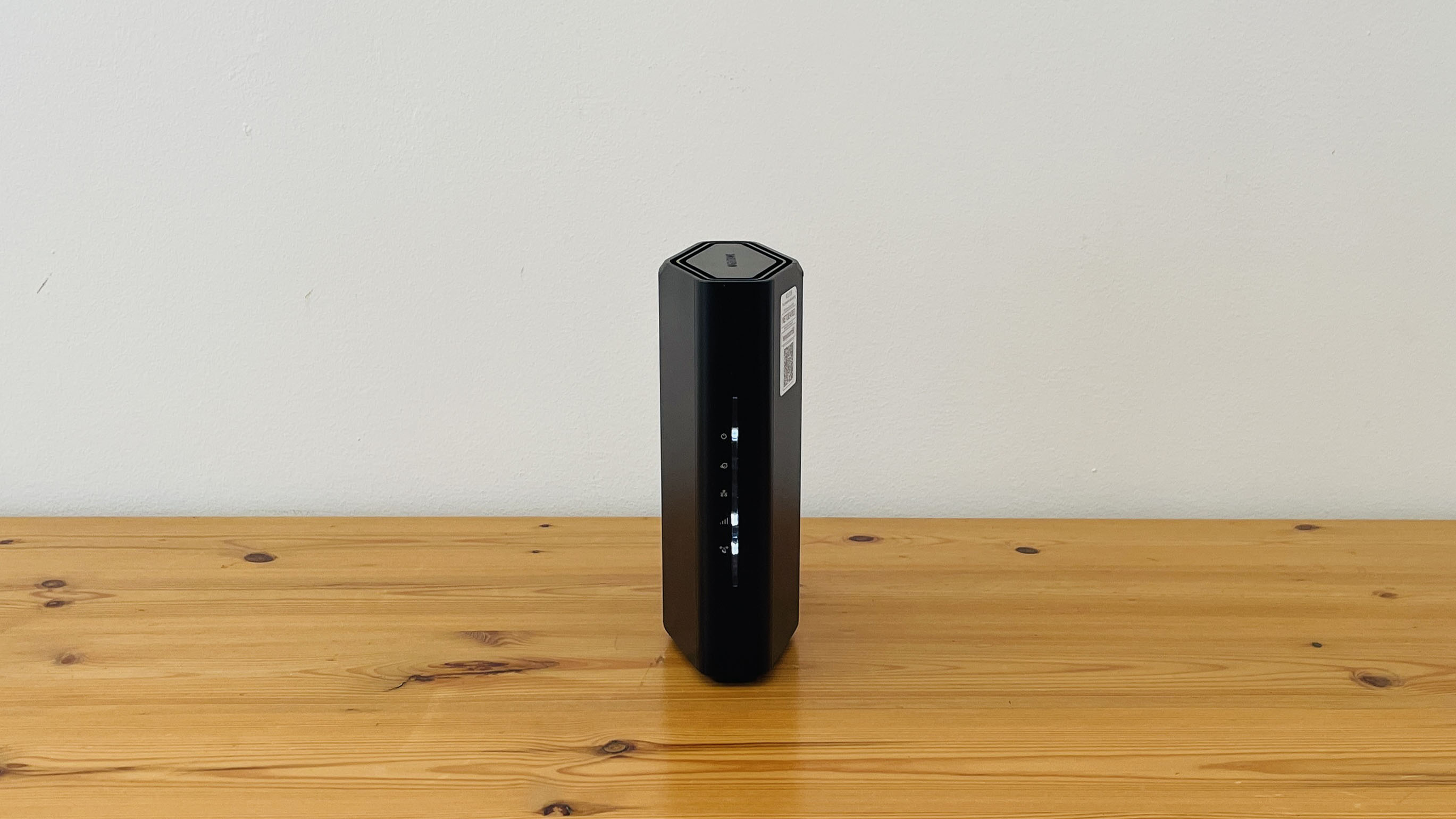 Netgear Nighthawk RS100 router on wooden table