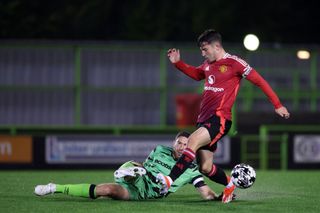 Dan Gore of Manchester United battles for the ball during the U21 National League Cup match between Forest Green Rovers and Manchester United at The New Lawn on October 09, 2024 in Nailsworth, England