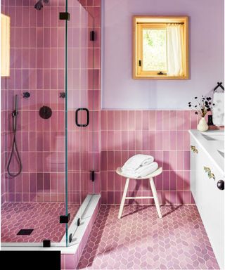 Pink bathroom scheme with tonal pink floor and wall tiles