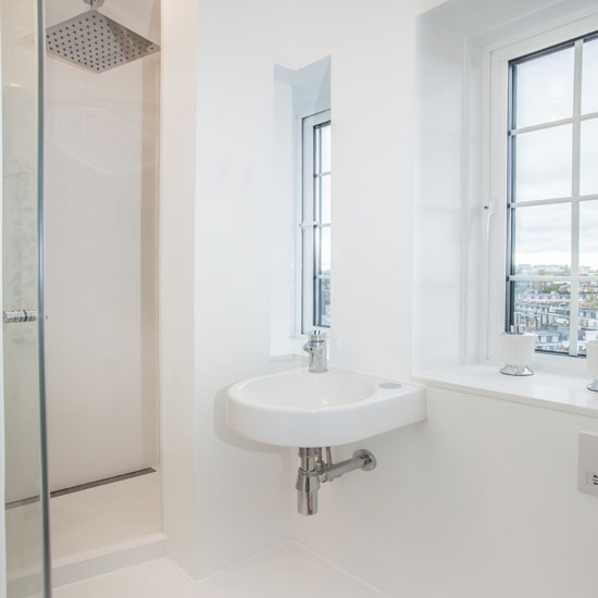 bathroom with white wall and shower