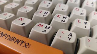 The Drop LOTR ENTR keyboard keycaps close up.