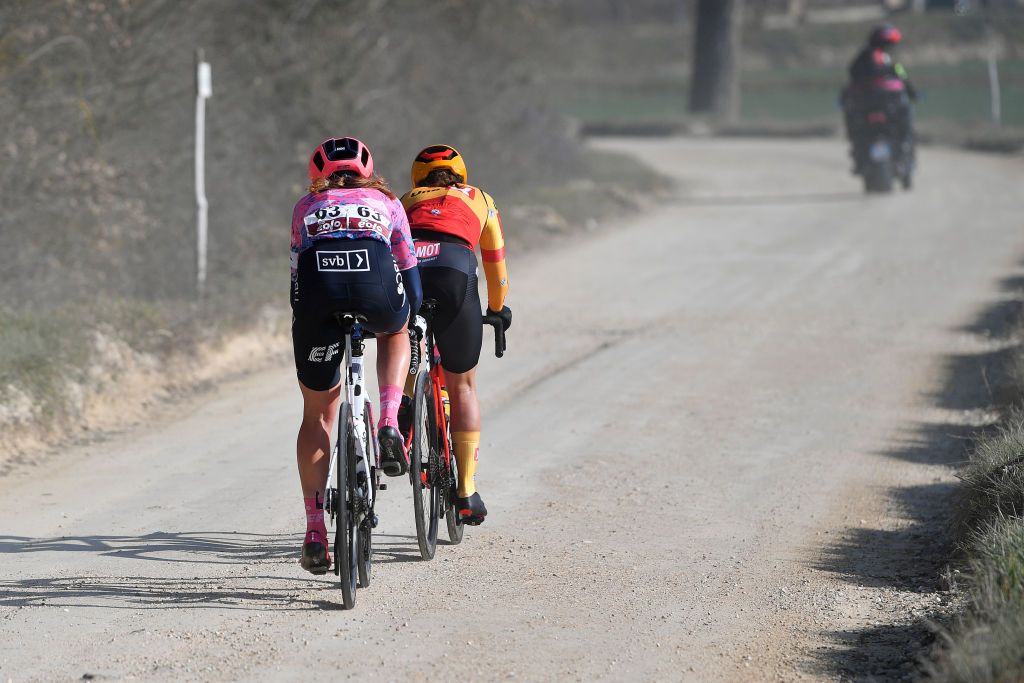 SIENA ITALY MARCH 05 LR Emily Newsom of United States and Team EF Education Tibco Svb and Rebecca Koerner of Denmark and UnoX Women Cycling Team compete in the breakaway through gravel roads during the Eroica 8th Strade Bianche 2022 Womens Elite a 136km one day race from Siena to Siena Piazza del Campo 321m StradeBianche on March 05 2022 in Siena Italy Photo by Luc ClaessenGetty Images
