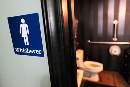 A gender neutral bathroom sign outside a bathroom in North Carolina