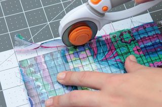 Use a rotary cutter to trim the patchwork quilt block
