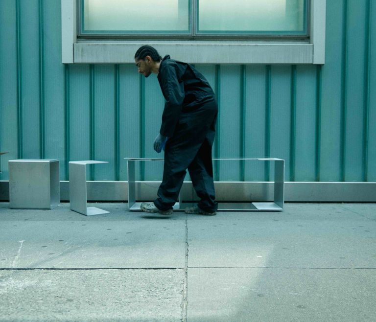 Emmanuel Popoteur with his designs