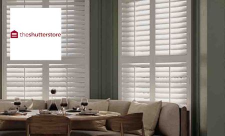 shutter store logo with blinds in living room