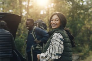 Friends arriving at a campsite