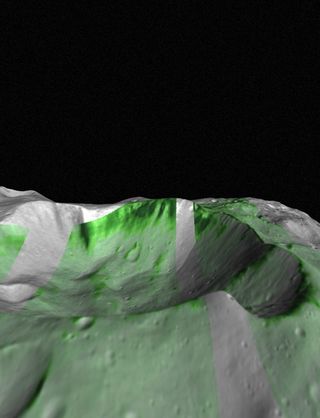 Olivine, a mineral commonly found in mantle rocks, has been detected on Vesta by NASA's Dawn spacecraft. Olivine outcrops within Bellicia crater are shown in deep green. The Infrared hyperspectral images are projected on Vesta combining imaging and topography data from NASA's Dawn spacecraftcamera images.