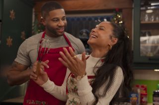 Christina Milian laughs in a kitchen in 'Meet Me Next Christmas'