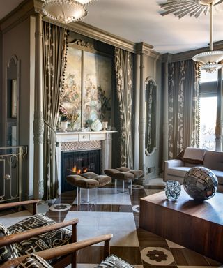 Grand gray living room with floor to ceiling gray windows