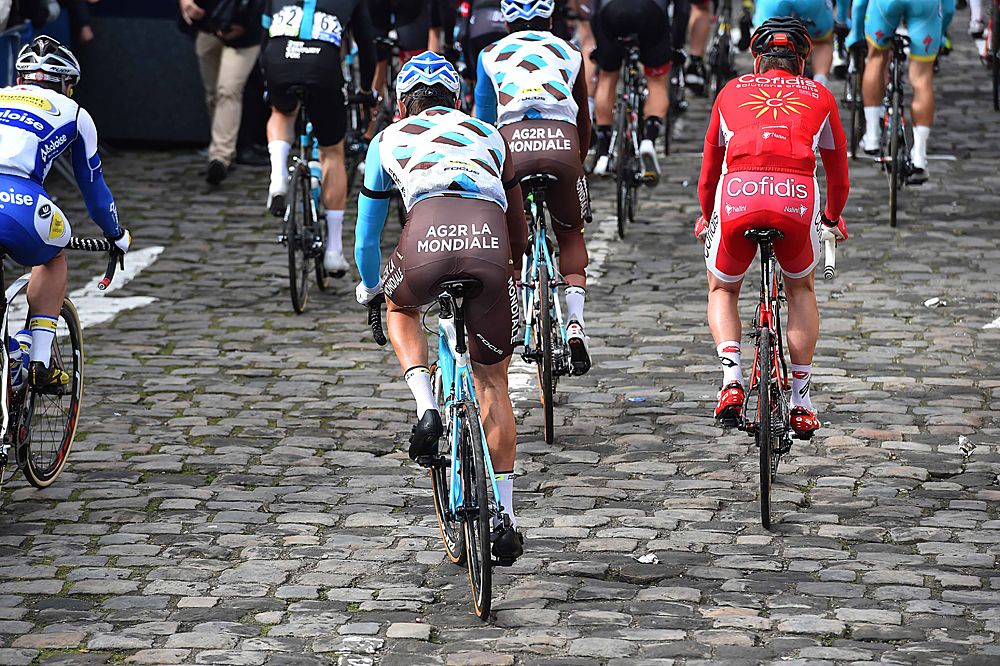 The riders hit the cobbles at the start of Paris-Roubaix