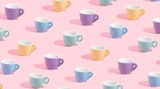 Colorful espresso cups on a pink background