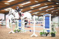 Amy Capper and Dooneens Electric qualify for the London International Horse Show in the 128cm grand prix at South View English Home Pony