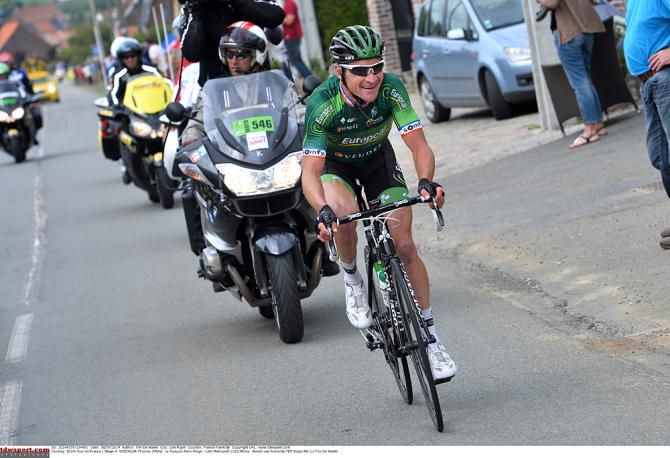 Breakaway rider Thomas Voeckler (Europcar) goes on alone after losing his companion Luis Mate (Cofidis) to a puncture