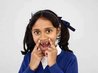 Photograph of a child showing their wonky teeth, photographed by leading British photographer Rankin for the Rankin X Aquafresh campaign
