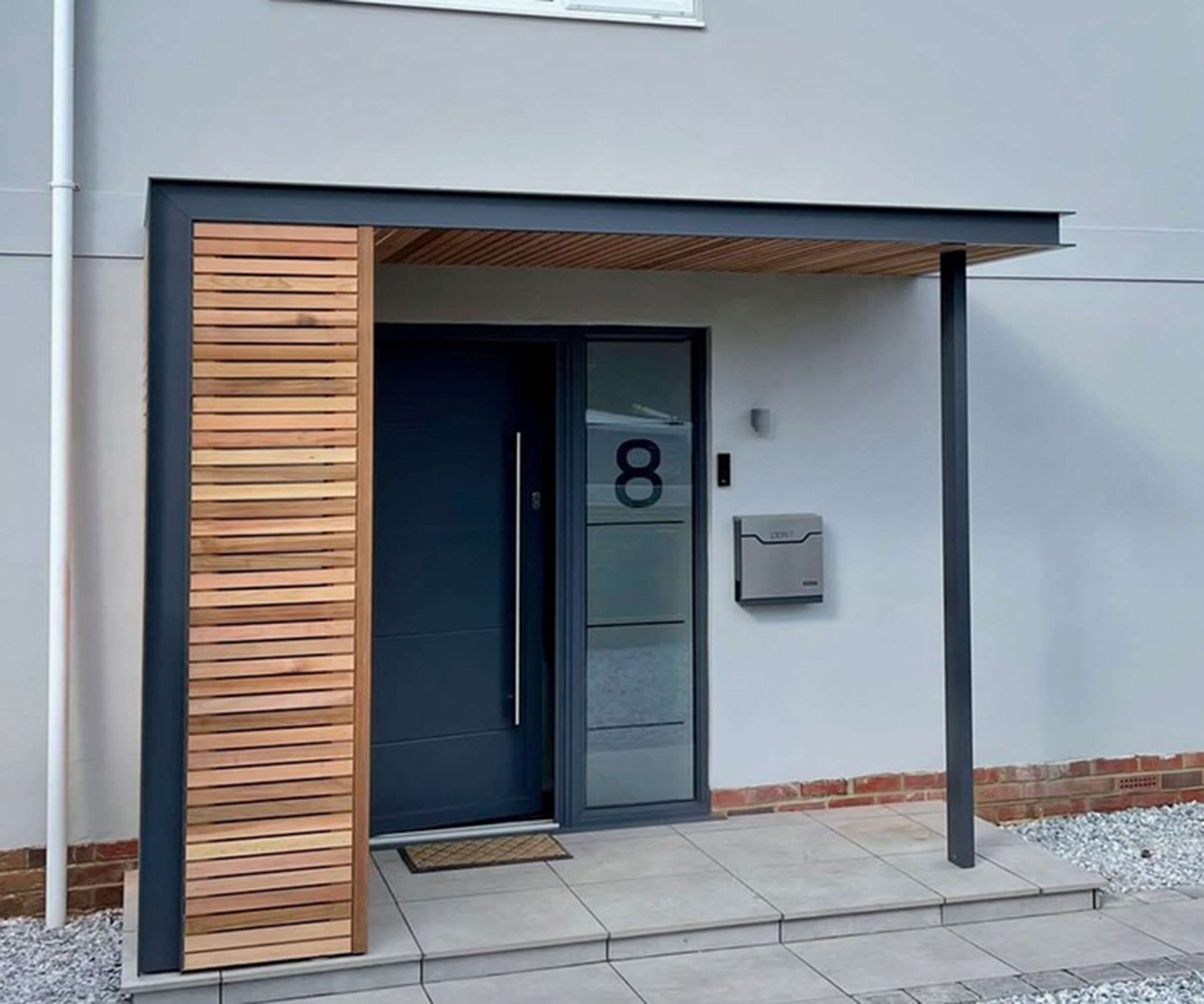 timber and grey metal modern flat roof porch