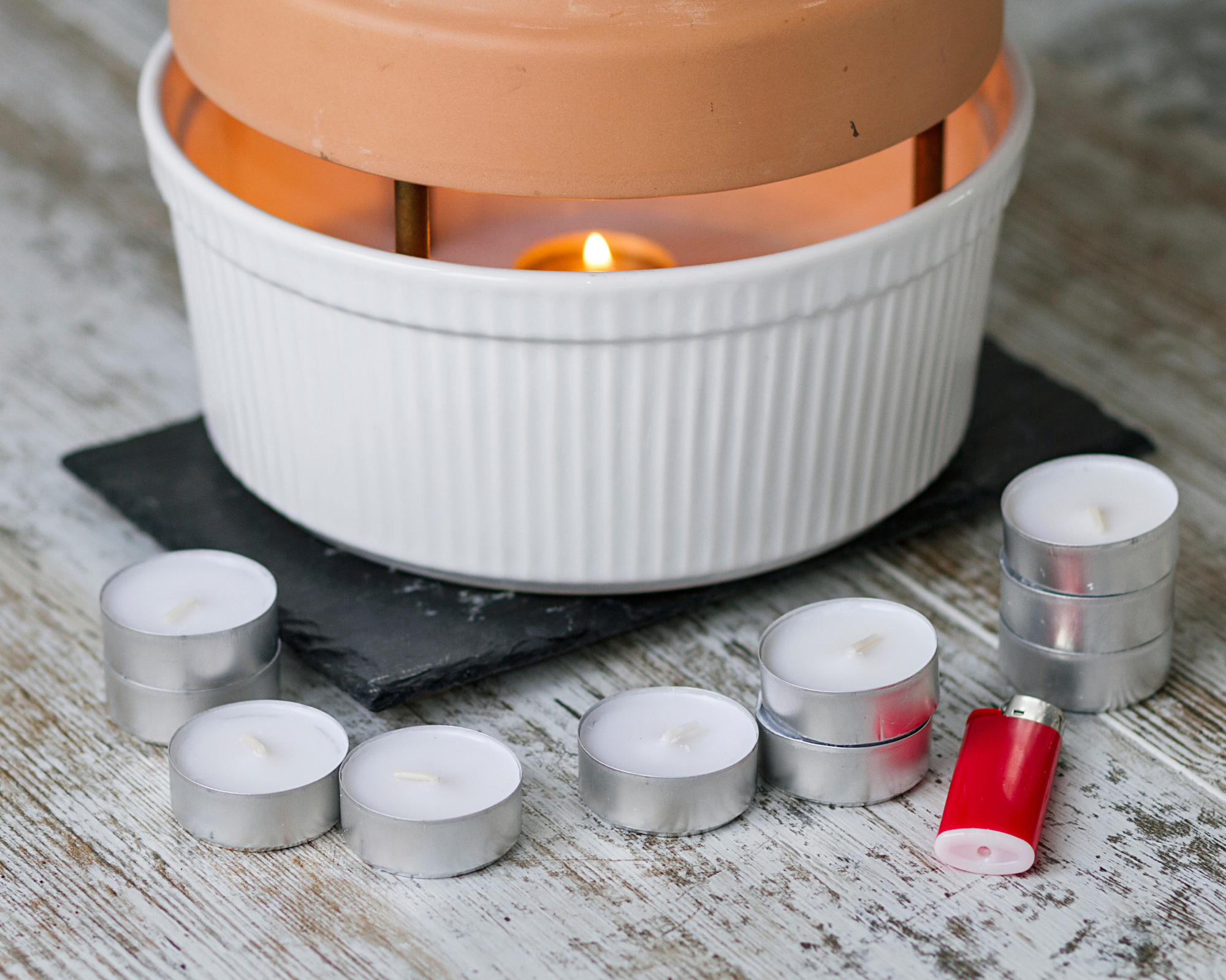 terracotta pot heater with candles and lighter