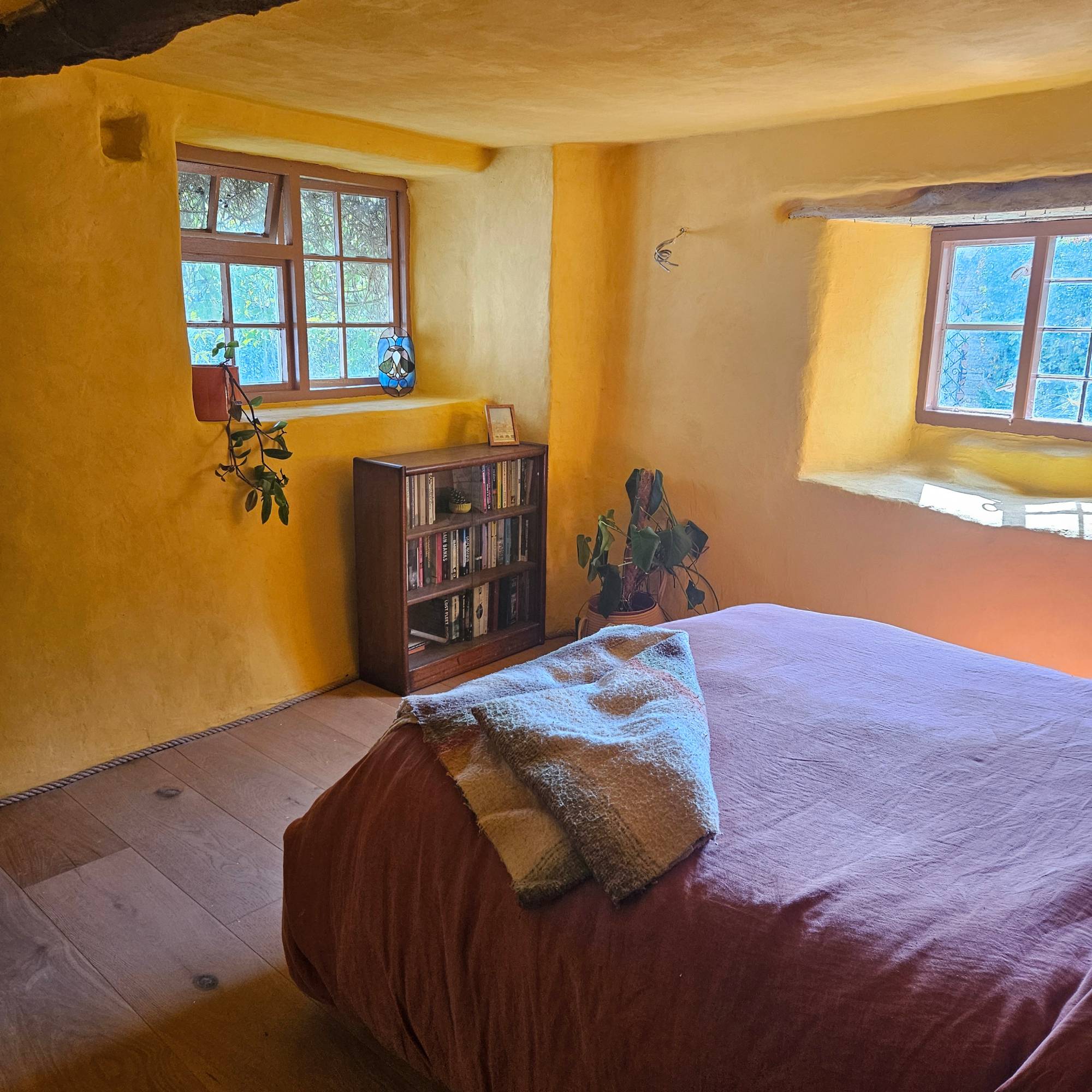 yellow bedroom with newly painted windows