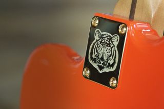 Inset of the neck plate with tiger face
