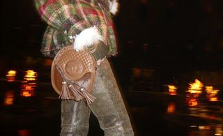 model holding brown bag