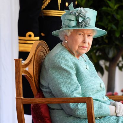 windsor, england june 13 queen elizabeth ii attends a ceremony to mark her official birthday at windsor castle on june 13, 2020 in windsor, england the queen celebrates her 94th birthday this year, in line with government advice, it was agreed that the queens birthday parade, also known as trooping the colour, would not go ahead in its traditional form photo by toby melville wpa poolgetty images