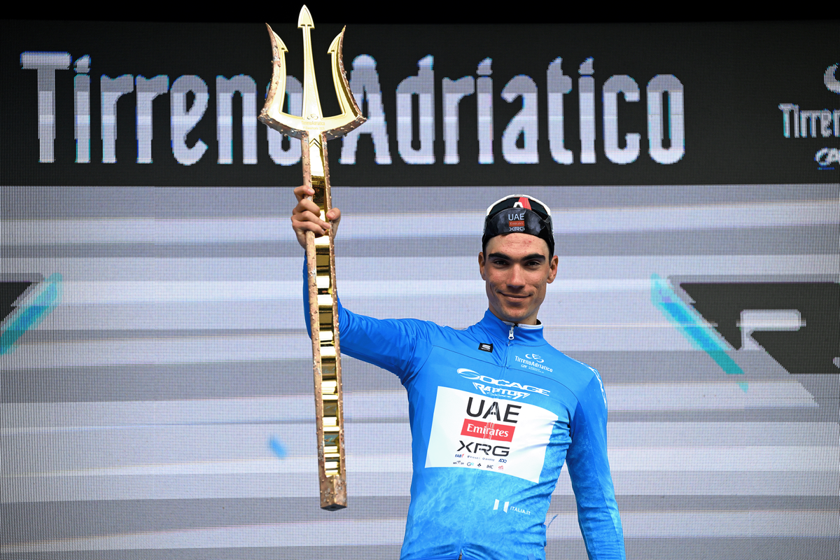 SAN BENEDETTO DEL TRONTO, ITALY - MARCH 16: Juan Ayuso Pesquera of Spain and UAE Team Emirates XRG - Blue Leader Jersey celebrates at podium as final overall race winner during the 60th Tirreno-Adriatico 2025, Stage 8 a 147km stage from Porto Potenza Picena to San Benedetto del Tronto / #UCIWT / on March 16, 2025 in San Benedetto del Tronto, Italy. (Photo by Tim de Waele/Getty Images