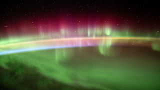 The aurora australis streams across the Earth's atmosphere as the International Space Station orbited 271 miles above the southern Indian Ocean in between Asia and Antarctica.
