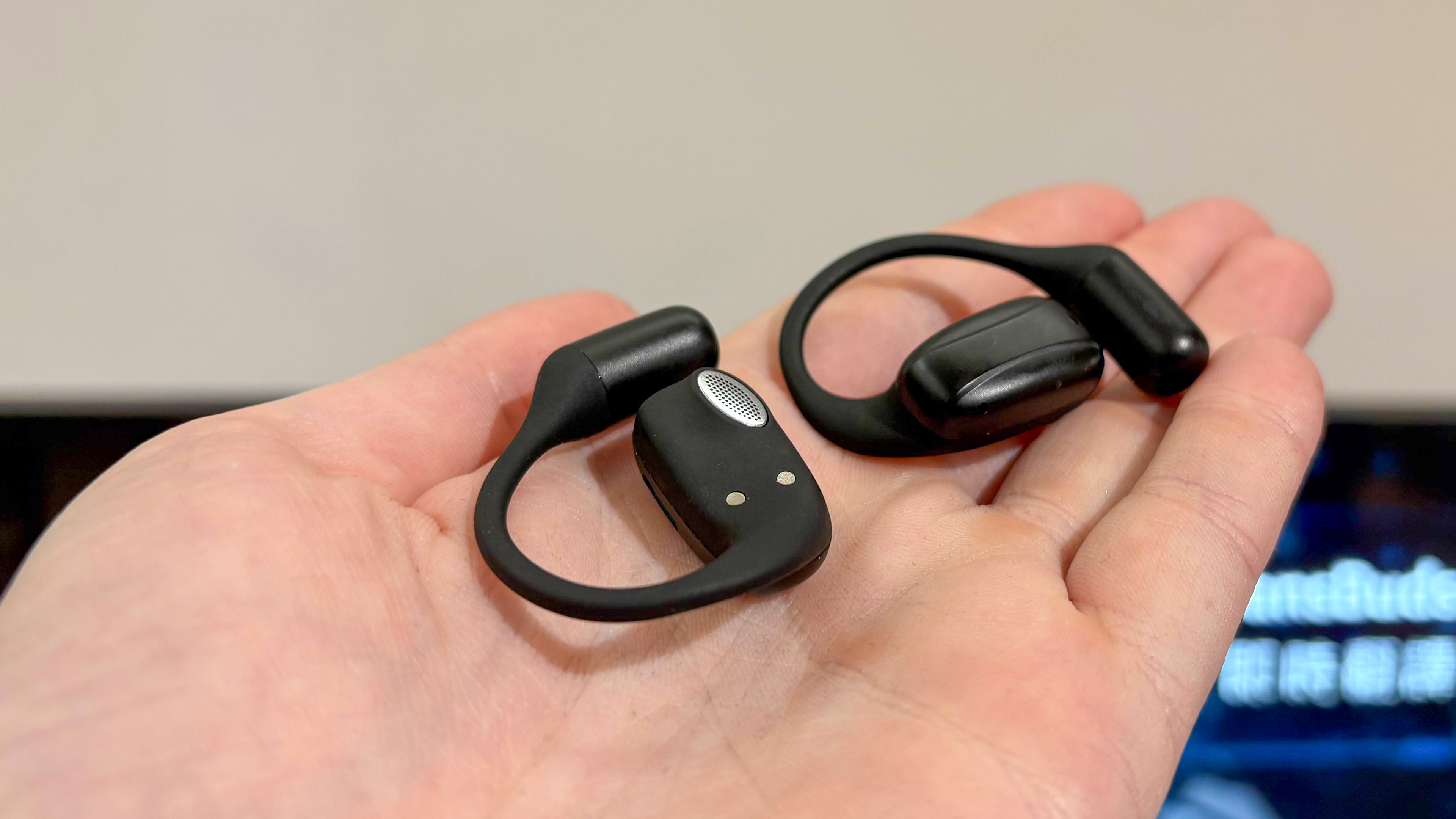 Acer AI TransBuds in hand