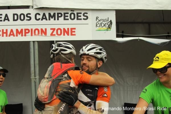 A team hugs after the finish