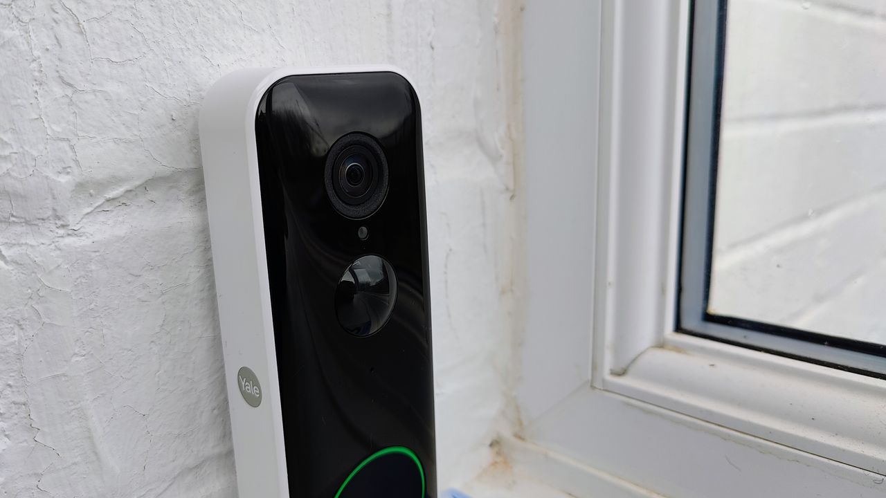 Yale Smart Video Doorbell review: device on a white wall from the side 