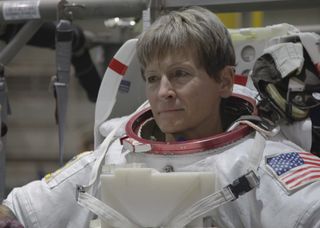 NASA astronaut Peggy Whitson prepares to enter the neutral buoyancy pool at NASA's Johnson Space Center in Houston for spacewalk training.